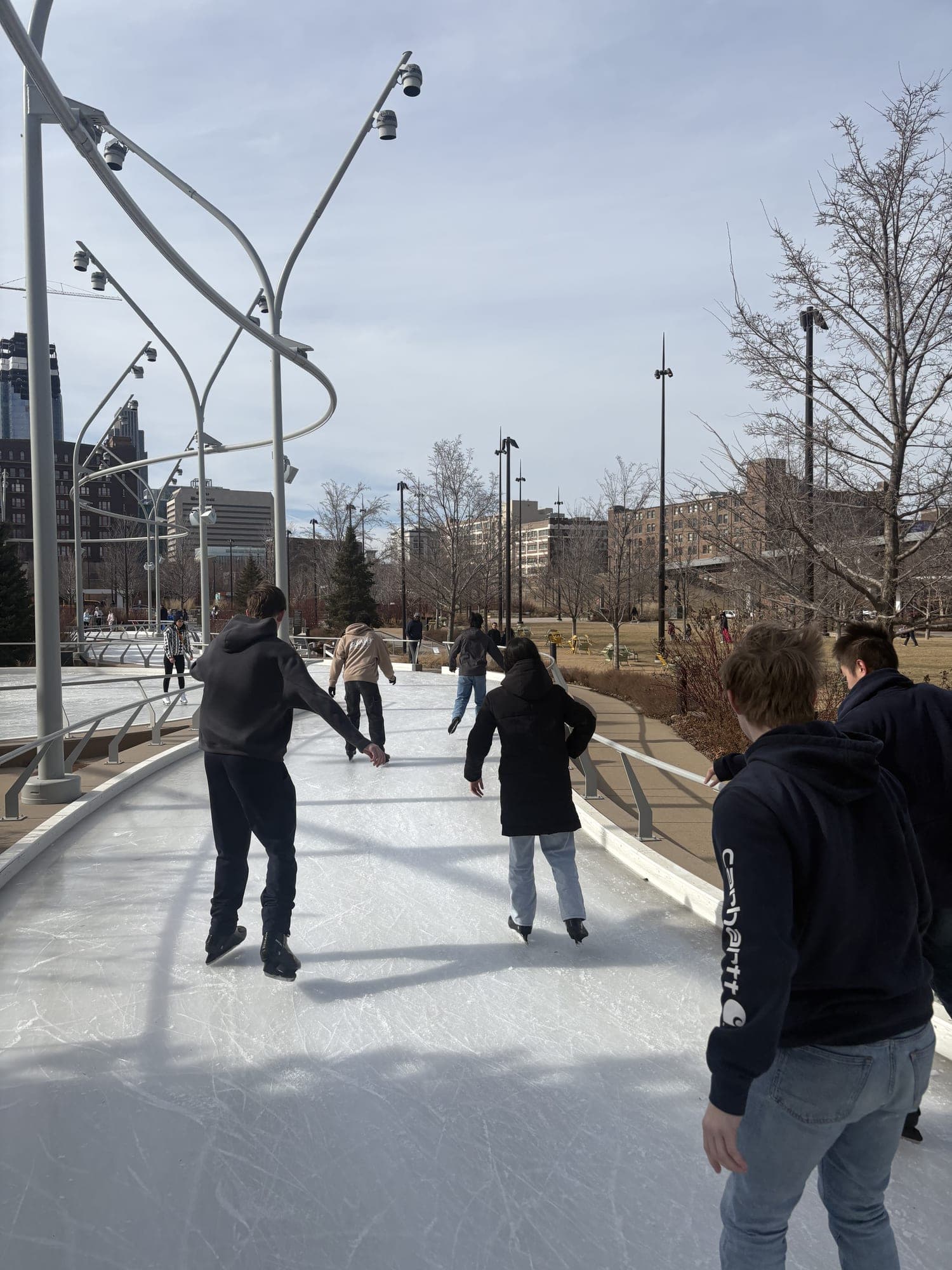 Residents out on the ice at a skating rink.